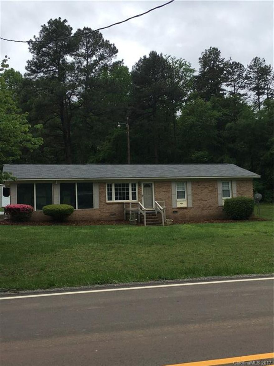 Lovely 2 bedroom, 1 bath ranch home on just over 2 acres of land in the Steel Creek area.  Den off the galley style kitchen with breakfast nook. Large sunroom with separate thermostat for heat and central air.  Original hardwoods in both bedrooms, den and living room. Roof was replaced this year and a new well in 2014.
Close to shopping at the Charlotte premium outlets and the Rivergate shopping center.  Less then a half hour to Uptown with many restaurants near by.