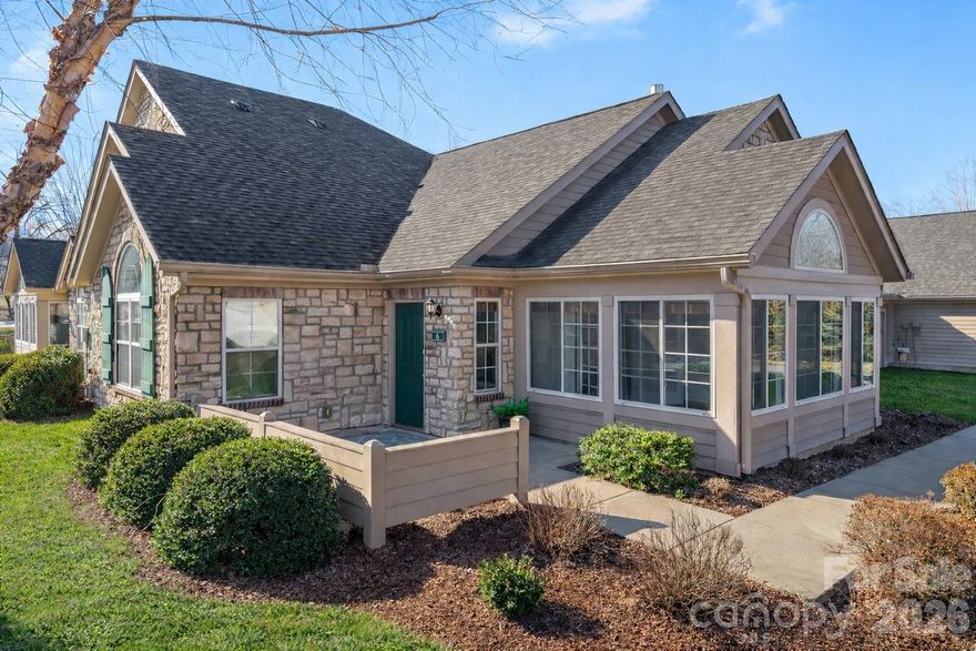 Beautifully updated, light-filled townhome located in the sought-after Hamburg Crossing community in Weaverville. Known for its tree-lined streets, lush landscaping, and inviting curb appeal, this home enjoys a desirable placement within the community.

It smells like new when you walk inside, with new paint throughout and new LVP flooring contributing to a crisp, refreshed feel. Vaulted ceilings, attractive architectural details, and arched windows create an airy, spacious atmosphere filled with natural light. The inviting living area features a cozy fireplace and flows seamlessly into a sun-drenched sunroom, perfect for relaxing or enjoying the surrounding neighborhood views.

The spacious kitchen is thoughtfully designed with granite countertops, a breakfast bar, pantry, abundant cabinetry, and a new refrigerator, making it ideal for both everyday living and entertaining. Both bedrooms feature vaulted ceilings and generous walk-in closets, while a convenient closet just off the mudroom provides additional storage.

A 2-car garage adds functionality, and the low-maintenance lifestyle of Hamburg Crossing allows you to enjoy easy access to Weaverville’s shops and dining, Lake Louise Park just minutes away, and a quick commute to Asheville.