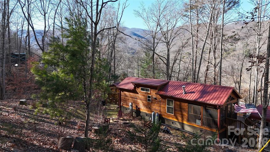 Nestled in the peaceful mountain setting of Candler, NC, this thoughtfully designed tiny home offers stunning mountain views and the perfect blend of privacy and convenience. Located just 20 minutes from Mount Pisgah and the scenic Blue Ridge Parkway, outdoor recreation is easily accessible.
Enjoy quiet mornings and relaxing evenings surrounded by nature, all while being only 20 minutes from downtown Asheville. This unique property is well-suited for use as a second home, full-time residence, or short-term rental investment.