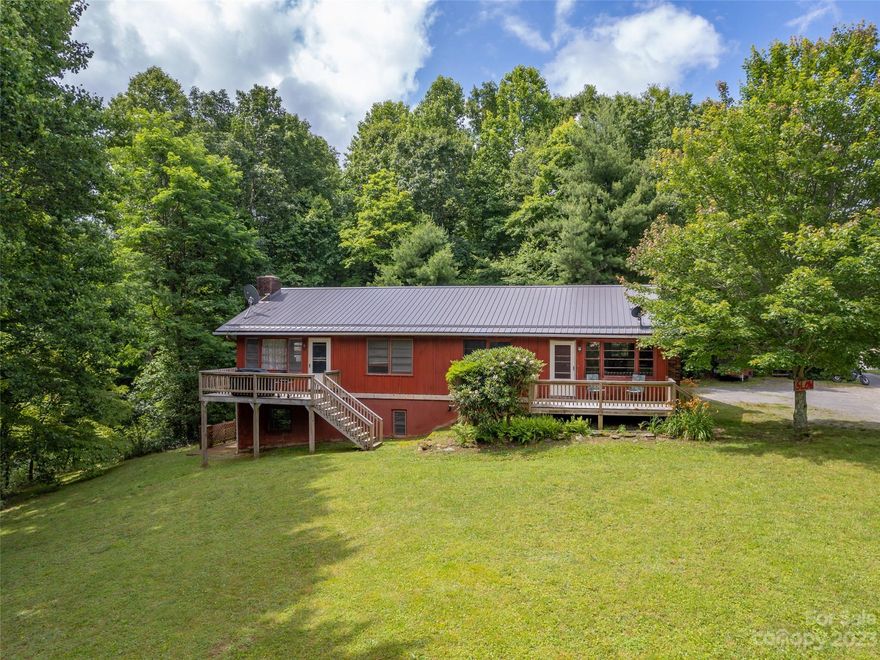 Calling all savvy buyers and investors! Don't miss out on this golden opportunity to own a rare triplex in Henderson County, offering three income-producing rentals. With its own private entrance for each unit and a new metal roof in 2023, this property is an absolute gem nestled on 1.4 acres near Mt. Olivet. Embrace the allure of a charming rural setting while enjoying easy access to Flat Rock, Hendersonville, and Saluda. Act fast and secure your slice of rental market success before it slips away!