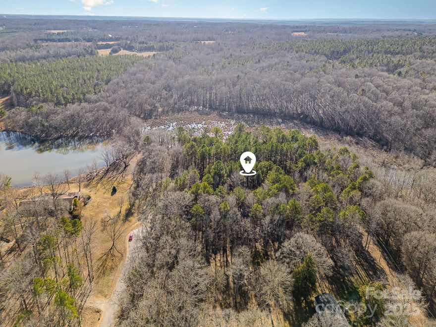 Waterviews and No HOA!! Build your dream home on this cul-de-sac 6.56 acre lot. Small community with established trees and views of Moss creek lake.