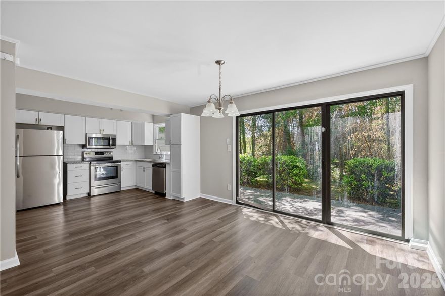 Beautiful End Unit townhome with fabulous outdoor patio and attached 1 car garage and carport! This 3 bed 2.5 bath home has been refreshed with LVP floors, updated lighting and fixtures and SS appliances. Walkable to McAlpine Greenway and McAlpine Park.