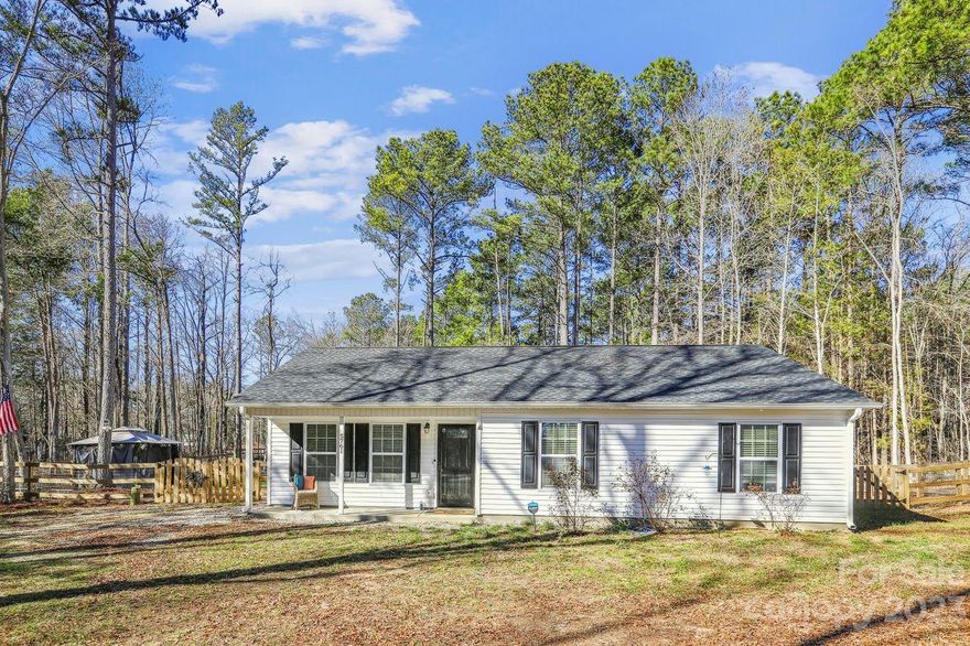 Motivated Seller, Price Improvement. Step into your beautiful, like new 2022 ranch-style home, located in the charming town of Fort Lawn, SC. This serene retreat, nestled on a private 1.4 acre lot, boasts 3 bedrooms and 2 bathrooms. As you enter, take in the open floor plan, perfect for modern living. The kitchen is spacious, complete with a stunning butcher block island, soft-close cabinets, and sleek stainless steel appliances that add a modern touch. The luxury vinyl plank flooring throughout the home provides durability, easy maintenance, and a sense of warmth and style. The fenced yard offers privacy for enjoying your morning coffee or hosting summer barbecues. This home is in excellent condition, like-new, and ready for you to move in and start creating memories. Enjoy a tranquil lifestyle while still being in easy reach of amenities and activities.