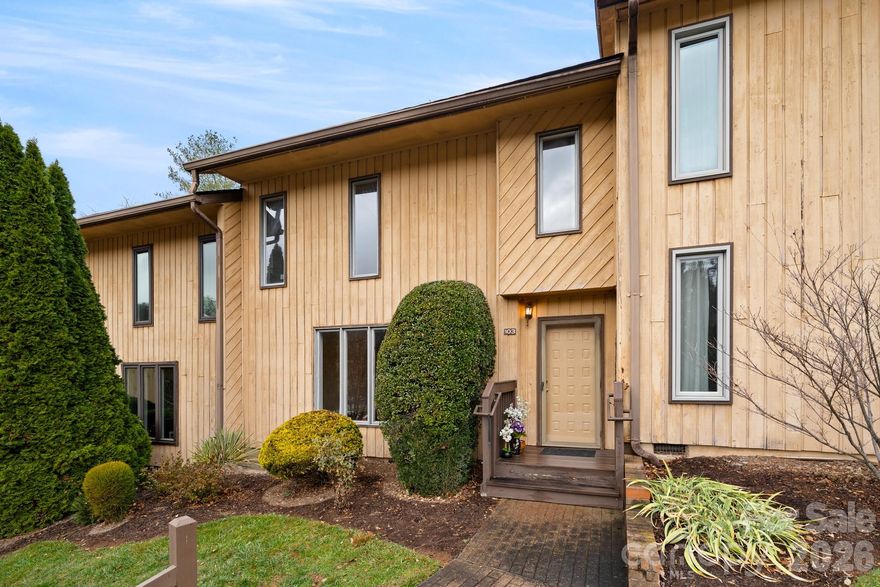 Tucked quietly at the back of a charming condo community, this inviting home offers a peaceful retreat while keeping you close to everything that makes South Asheville so desirable. One of the larger two-story floor plans in the neighborhood, it features 3 bedrooms and 2.5 baths thoughtfully designed for comfortable, everyday living.

The main level welcomes you with rich hardwood floors and a cozy wood-burning fireplace anchoring the living room. An open dining area flows effortlessly from the living space, creating an ideal setting for both casual dinners and entertaining friends. The bright, spacious kitchen offers ample room to cook and gather, complete with a dishwasher, electric range, refrigerator, and a sunny eat-in breakfast nook.

Sliding glass doors off the dining area fill the home with natural light and lead to a private tiled patio—perfect for morning coffee, afternoon relaxation, or quiet evenings outdoors. A convenient laundry closet and half bath are neatly tucked along the hallway, adding function without sacrificing space.

Upstairs, all three bedrooms feature wood-laminate flooring and ceiling fans for year-round comfort. The primary bedroom includes an ensuite bath, while a generous hall bath serves the additional bedrooms with ease.

The community itself adds to the appeal, offering a refreshing swimming pool, a tranquil creek with benches for peaceful moments, and a charming lending library box for neighbors to share and enjoy.

Ideally located just off the Hendersonville Road corridor, this condo places you moments from shopping and dining at Biltmore Park, easy access to the airport, outdoor adventures in Bent Creek Forest, and the vibrant culture of Downtown Asheville. This home delivers the perfect blend of comfort, community, and convenience—an exceptional opportunity for enjoying the South Asheville lifestyle.