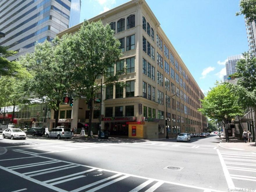 This home has a great view of Tryon Street and Uptown. With 16 ft ceilings and a wall of windows this home has great views of 5th Street, Tryon Street and the skyline. The kitchen is open to the large living room with fireplace and built-in cabinets to give an open feel. Everything Charlotte has to offer is just outside your front door. Great place to live with only a quick walk to work anywhere uptown.