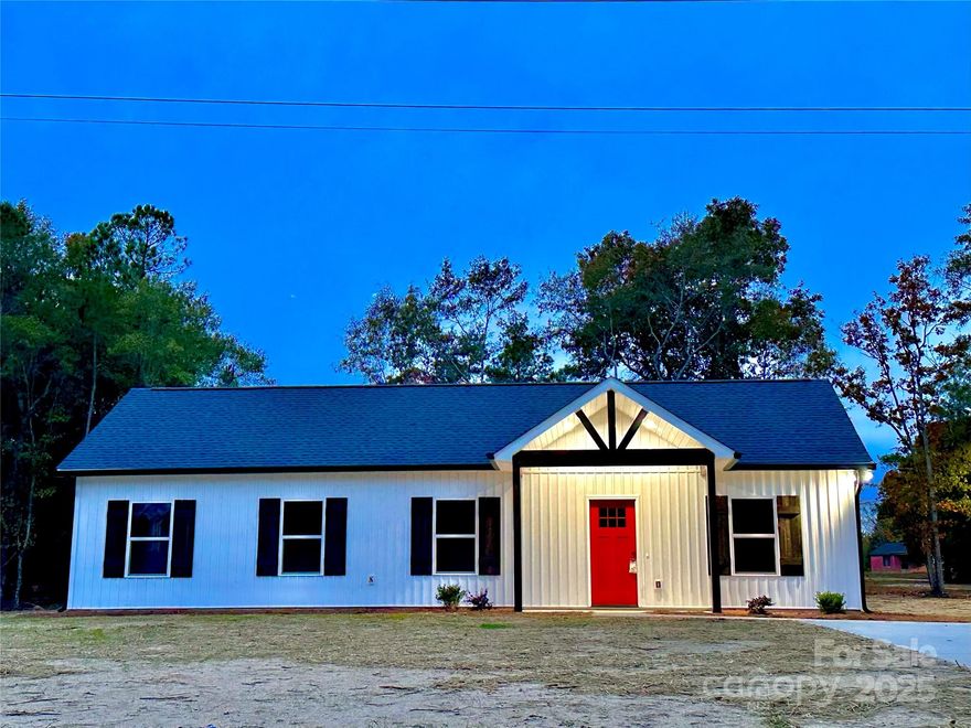 Construction Completed! Experience modern luxury in this stunning new farmhouse-style ranch. Thoughtfully designed with high-end finishes, this home showcases craftsman soft-close cabinetry, elegant quartz countertops and subway tile backsplash, LED recessed lighting, and ceiling fans with remotes. LVP flooring flows seamlessly throughout, offering both style and durability. Set on a spacious, private wooded lot, this residence provides a serene retreat away from busy traffic—paired with the benefit of low taxes. Anticipated completion by early November.