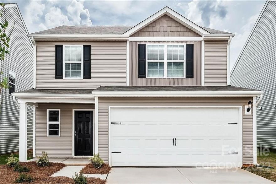 This two-story floor plan features an open-concept layout. The home boasts three bedrooms and two and a half bathrooms including a stunning private master suite with a large walk-in closet. The covered front porch gives this home great curb appeal while the private back yard provides a perfect outdoor space to sit and relax in the evenings. With granite counter tops, wood cabinetry with crown molding and recessed lighting, the kitchen is the stunning centerpiece of the home.