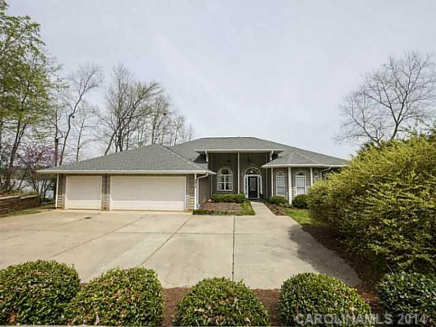 You won't want to leave!  Picture perfect home, deep open water & unmatched views are just the beginning.  Gourmet custom kitchen, ss appliances, granite, 3 car heated garage, 2-sided fireplace inside w/ additional outside fire-pit, covered boat slip, desirable open split-bedroom plan. High ceilings and oversized windows fill this home with light and panoramic views that are unforgettable! Enjoy!