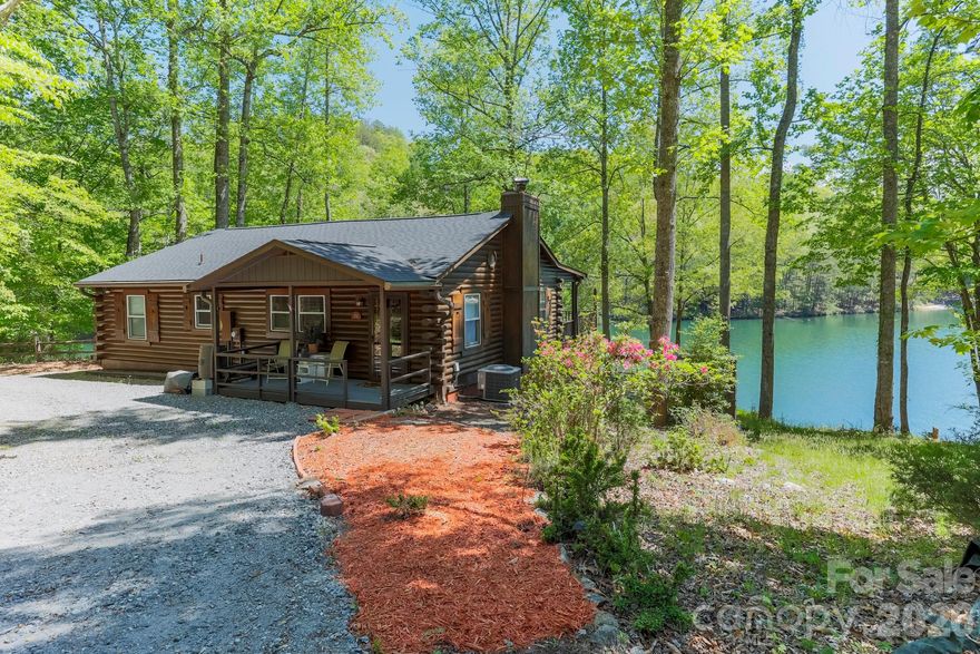 Breathtaking 180 degree lake views from this 2 bedroom, 2 bath, lakefront home on beautiful Mirror Lake in Riverbend @ Lake Lure. This incredible waterfront property has over 290 feet waterfront and offers the best views of the lake....and the privacy you've been looking for. This amazing property is priced to sell fast at only $595,000......the cost of a small lot on Lake Lure with no house.