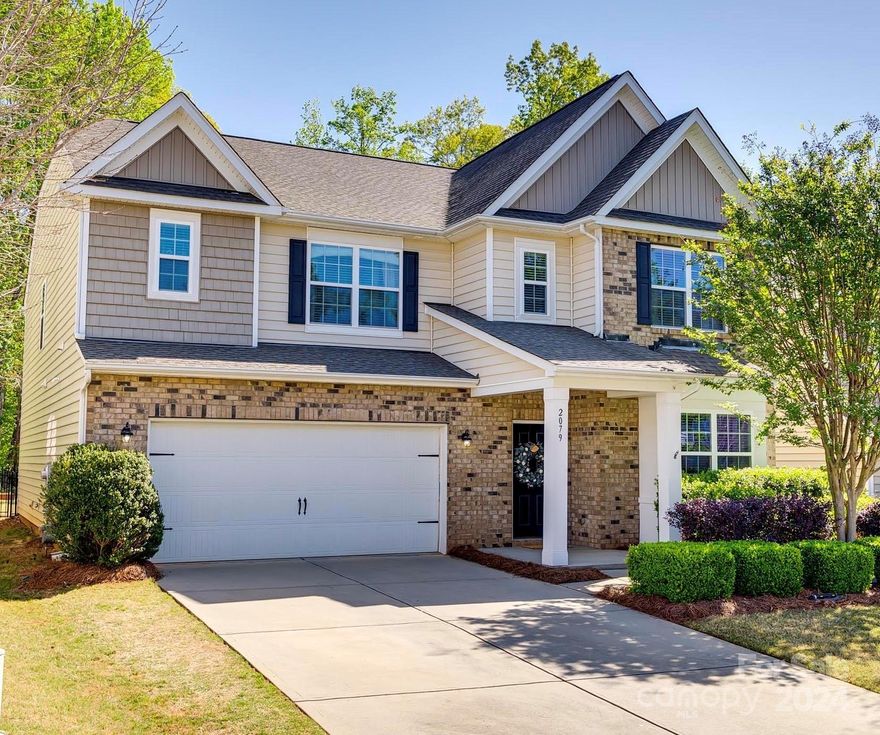 Welcome home to Carolina Reserve! This inviting Grisham model boasts an open layout, updated wood floors, and new carpet! The first level features a private office, formal dining room, breakfast area, & an open kitchen with granite counters, ample cabinet space, and SS appliances. The great room is the perfect space to gather, with beautiful built-ins and a gas fireplace. The guest suite on the main floor has a full private bath and a walk-in shower. Upstairs, you will be greeted by a spacious loft and 4 additional large bedrooms, each with walk-in closets & direct access to a bathroom. The laundry room completes the second level.  Step outside to the expansive stamped concrete patio where your private, fenced & level backyard overlooks the woods. The shed provides additional storage or hobby space. Updated HVAC (2021) and water heater (2023), both with warranty.  Neighborhood amenities include a pool, clubhouse, fitness center, playground, dog park, pond, and walking trails.