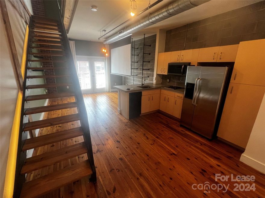 Discover urban living at its finest with this 1 bed, 1 bath loft in the heart of NoDa! Featuring stunning hardwood floors, sleek granite countertops, and a modern kitchen with a fridge, microwave, and dishwasher, this space offers both style and convenience. Enjoy beautiful street views and a roll-down screen from the ceiling for cozy movie nights. Located right above Sabor Latin Street Grill, Jugo Bar, and Jack Beagles, you’ll have unbeatable access to the vibrant dining and entertainment options that define NoDa. Make this stylish loft your new home and experience the best of city living. This unit is pet friendly!