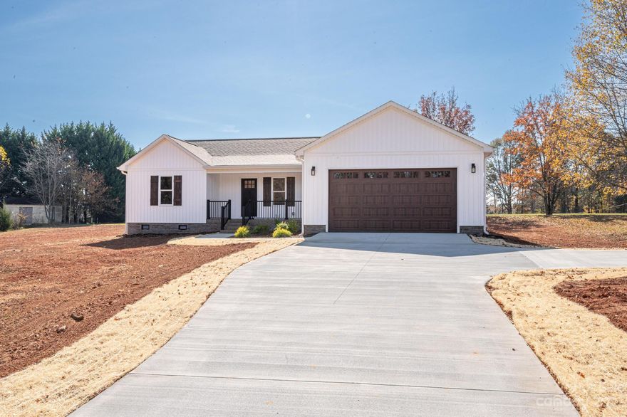 Construction Completed 11/10/2023!  Move-In ready!  Brand new modern farmhouse sitting on approximately 1 acre with all of your favorite finishes!  Low maintenance LVP flooring, finished garage, quartz counter tops, and a tiled master shower complete with a waterfall shower head!  Tastefully washed with a gray color scheme where all of the details and finishes coordinate meticulously including stainless steel appliances.  If you have been wanting to build but don't want to wait for your dream home to be completed, look no further!    5 Minutes to downtown Lincolnton.  Approx 45 minutes to Charlotte.