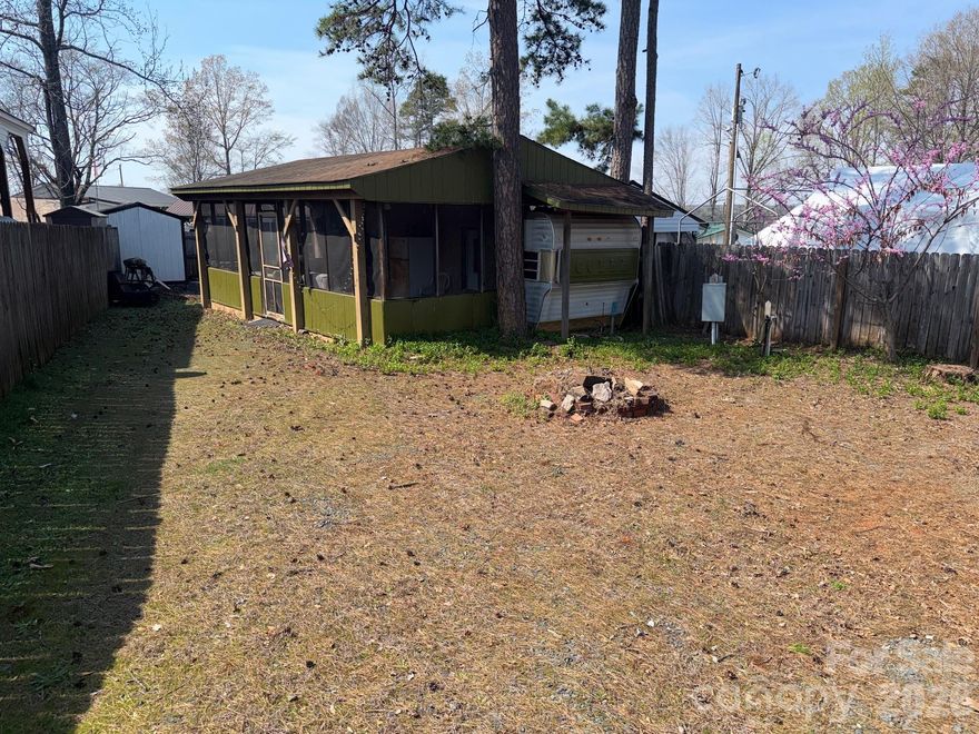 Great Opportunity awaits in Twin Harbor. Lot currently consists of a Cobra camper pulled up to a 10x28 screened porch addition.  The screened porch addition washer and dryer connection. This is a great flat lot with tons of potential. Seller is willing to remove the camper if new buyer does not want. Great opportunity to make this unit your own or bring your own camper and pull up to it.  Twin Harbor offers great amenities including mini golf, outdoor pool, lots of entertainment throughout the year, pickleball, basketball court, playgrounds, beach area, boat ramps and so much more.