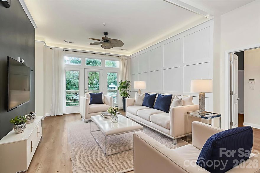 GREAT SOUTH END LOCATION! This gorgeous MOVE-IN READY open-concept condominium boasting soaring 10’ ceilings w/elegant crown molding has been thoughtfully & recently upgraded for style & function & features board-and-batten accent walls that add charm & architectural interest throughout. Custom “Closets by Design” storage includes a maximized master closet, redesigned entry closet, & built-in custom storage solutions. A wet bar & built-in media center enhance convenience & modern appeal. The kitchen has coffered ceiling, above-counter composite farm sink, waterfall faucet, ornate tile backsplash, & granite countertops on both the perimeter & island w/updated appliances including Refrigerator. The master bath features quartz countertops & designer finishes. Located in one of Charlotte’s most sought-after communities w/private parking lot & Semi-private balcony. Unbeatable location w/shopping, dining, coffee shops, & parks within walking distance. Steps from the light rail for quick access to Uptown & South End.