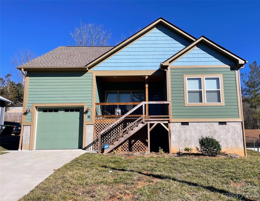 Introducing a stunning home for sale in North Asheville, conveniently located to all urban offerings of Woodfin, Asheville, and Weaverville. This home was built with detail and precision in 2021 and has all the modern touches including an open floor plan, updated blinds and doors, state-of-the-art appliances, and lovely outdoor relaxation space in the front and the back. The home has smart technology including an ADT alarm system, an Ecobee 3 Thermostat, and a Ring doorbell installed. Inside the kitchen, you will find easy-close cabinets and drawers, along with a sleek countertop and plenty of storage with dining space adjacent. The yard has been professionally graded with French drains to ensure no moisture, along with outside access to the attached garage which has extra storage space available and high ceilings. This location provides easy access to HWY 26 and minutes from all amenities desired, while also providing privacy and very low road traffic. Check it out today!