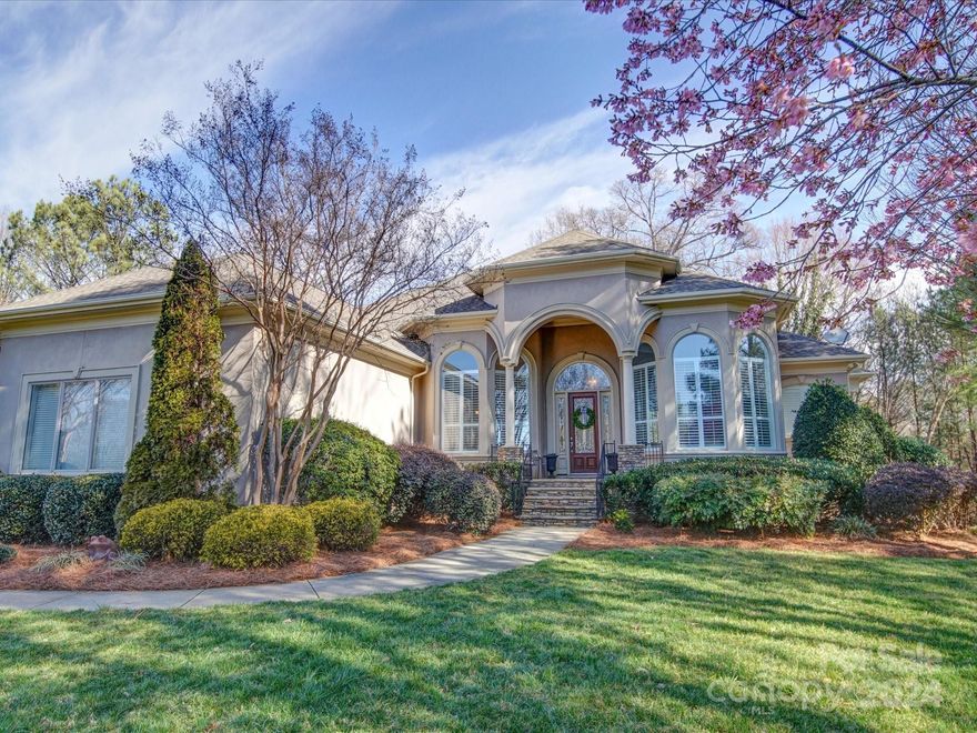 TRIFECTA ALERT!  This Mediterranean beauty has the best of 3 worlds: Lake Norman WATERFRONT w PRIVATE DOCK, GOLF course view and THE POINT, Lake Norman's most desired subdivision!   Step inside and be captivated by the floor to ceiling curved windows that offer views of both lake and golf course (hole #13)! This luxurious property boasts both a large primary bedroom on the main and another on the lower level.  All 5 bedrooms have en-suite bathrooms ensuring convenience for family and guests. Entertaining in this home couldn't be finer with its wonderful LANAI that sweeps the entire back of the home and its outdoor kitchen and bar to enjoy those lake sunsets.  This home has two cozy gas log fireplaces, one in the keeping room and one in the expansive basement.  Located behind the basement's secondary kitchen is the enchanting theatre room.  Come be a part of Trump National Golf Club, LKN's finest community with its numerous fantastic amenities!
