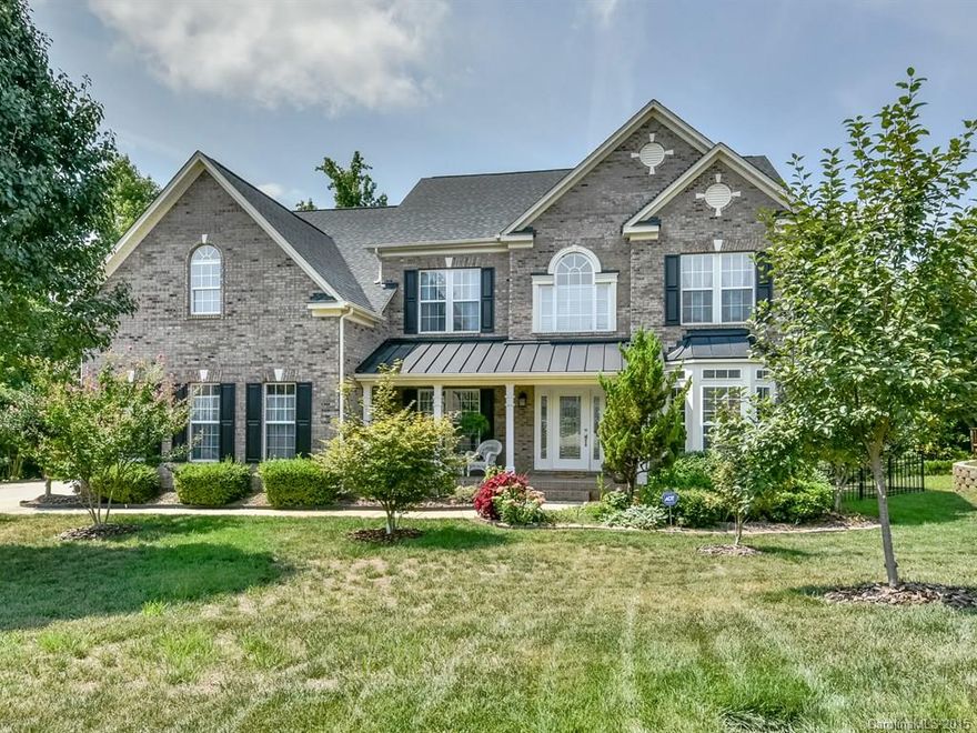 Wow! Gorgeous Home with a Large Screened Porch with Skylights Overlooking a PRIVATE, Wooded, Back Yard! Beautiful & open from Sunroom to Great Room with gas fireplace to vaulted Breakfast Area. Chef's Kitchen w/ SS appliances, gas cooktop, walk-in pantry, tile back splash, granite, lg work island/bar. Elegant Master with tray ceiling, his & her vanity & closets, columns, garden tub & sep shower. Versatile Media/Bonus. Front Porch. Fenced Yard. Set in Fort Mill Swim Neighborhood!