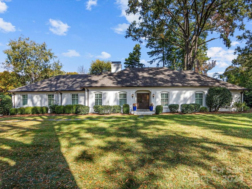 Welcome to your stately brick ranch on a large level lot in Foxcroft. Step through the custom mahogany front doors into the light filled foyer into a traditional split floor plan with living and dining rooms in the first half of the floor plan while the family room with built ins, wet bar and a gas log brick fireplace opens to the sunroom on the other side. Kitchen boasts white cabinets, tile backsplash, granite counter tops, SS appliances, and built in refrigerator flanked by a half bath off the side entry. 2 large secondary bedrooms down the hall share a large hall bath and at the end you’ll find a large primary suite with 2 walk-in closets, marble counters, separate shower and a Jacuzzi tub. A large paver patio on this expansive lot with 9 zone irrigation completes this home thats perfect for entertaining. Don't miss the recently enclosed 2 car garage with additional storage closets. Community amenities w/membership include pool, tennis, playground, and miles of walking trails!