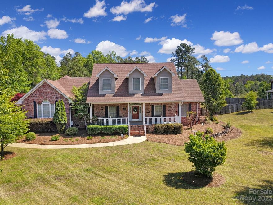 Looking for a home that has it all?  Enjoy this stunning two-story home impresses with its multiple living areas and main level primary suite. From the moment you pull in, you'll be taken by the luxurious curb appeal and perfectly manicured lawn with in-ground irrigation. Inside, enjoy an open concept living area, built in shelving and two fireplaces - one in the family room and another in the living room. The kitchen offers cabinet and counter space, stainless steel appliances, tile backsplash, and granite countertops! Your back deck overlooks your fully fenced backyard oasis complete with hot tub - perfect for entertaining or simply relaxing! Recent updates include freshly refinished wood floors and new main level HVAC system!!  Don't forget about the sunroom filled with natural light year round, plus a 3 car garage! Zoned for award winning Clover schools Windswept Cove is a beautiful and natural SC Lake Wylie community with a walking trail, clubhouse, and pool!