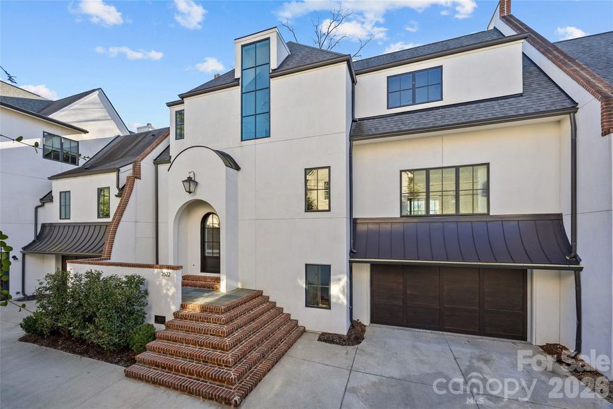 Stunning like-new townhome in the heart of Myers Park. One of only three residences in Chelsea Square, built in 2019 by Stanwick Dunham and designed by Mermans Architecture. Offering ~4,000 SF, this 3BR/2.2BA home blends refined design with effortless living just minutes from the Greenway, shops along Selwyn, and Park Rd Shopping Center. Charming stucco exterior with gas lantern entry welcomes you inside to white oak floors, high ceilings, custom millwork, and impeccable designer finishes throughout. Open main level features a chef’s kitchen with waterfall marble island, Wolf range, Sub-Zero fridge, scullery, and seamless flow to the dining area and family room with cozy fireplace. Luxe primary suite with marble bath and expansive closet. Den, bonus room, drop zone,  attached 2-car garage, and blue stone patio complete this exceptional home. All of this paired with the ease of low-maintenance living, offering a true lock-and-leave lifestyle without compromising luxury or space. Small "yard" area off the patio.  Home is built to accommodate an elevator that services all 3 levels, information can be provided upon request.