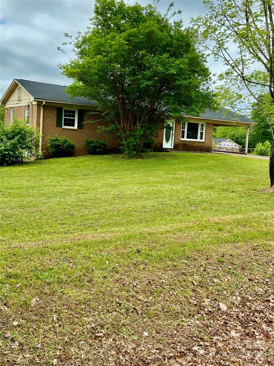 Wow...check out this basement home on 1.02 acres+/-. The back yard is almost the length of a FOOTBALL FIELD and it's fully fenced! Inside the home you'll find 4 bedrooms, 2 1/2 baths and a living room that's open to the kitchen and den. We are sure you'll enjoy the hardwood floors and great space.  The main level is approximately 1672 sq. ft. and the basement boasts another 1150 sq. ft.  Roof replaced in the Fall of 2023. Heat pump replaced in 2009.
Basement homes can be hard to find and this one has plenty of room for entertaining, home schooling or perhaps you can convert it into a home theater.
There is also a garage door that opens to a 'shop' area where you can keep your riding lawnmower, tools, motorcycle or holiday decorations. How about making it into an art studio? Let your imagination run wild!
The seller is having some exterior boards replaced along roof line. All yellow paint will be re-painted white by approximately mid-May.
We hope to see you SOON!