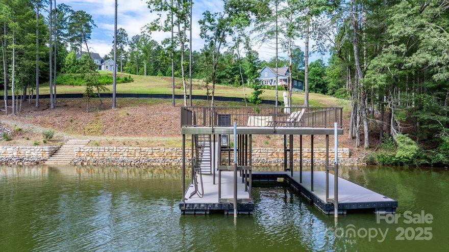 Rare opportunity to own a prime lakefront lot on the serene waters of Lake Rhodhiss in the heart of Connelly Springs, NC. This fully graded property is ready for your dream home, offering the perfect blend of natural beauty and modern convenience. 2-Story Dock, built in 2022 – includes boat storage and upper-level deck perfect for entertaining and sunset views. Retaining wall installed for 206 feet of shoreline stabilization – protecting your investment for years to come. 4-bedroom septic permit already approved – fast-track your build and save on development time. Gentle slope and cleared building area – ideal for walkout basement or multi-level home. Peaceful, established lakefront community with easy access to I-40, Morganton, and Hickory.
Whether you're planning a weekend retreat or full-time lake living, this property offers a deep-water lot, unbeatable value and readiness. Bring your builder and start your lake life today!