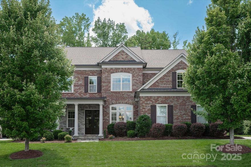 Beautiful full brick, 3 car garage home in popular Bridgemill community just 5 mins to the new CrossRidge Center which includes Target, , restaurants & shopping! Main floor features an office, large drop zone + a guest suite w/ full bath including tiled walk in shower.  Gorgeous kitchen includes a spacious counter level height island w/ quartz tops, large farm sink, gas cooktop & a walk in pantry. Second floor features a primary suite w/ HUGE walk in closet and primary bath with his & her vanities w/ quartz tops & a large tiled shower. Upstairs also includes a secondary bedroom w/ an en suite full bath & 2 additional bedrooms w/ a shared oversized secondary bath. The generously sized bonus room provides a great flex space. 400+sf unfinished 3rd floor provides a great opportunity for expansion or great storage space!  Take in the great NC weather from the covered front porch or private patio in the perfectly manicured backyard. Interior freshly painted! New carpet! Updated lighting!