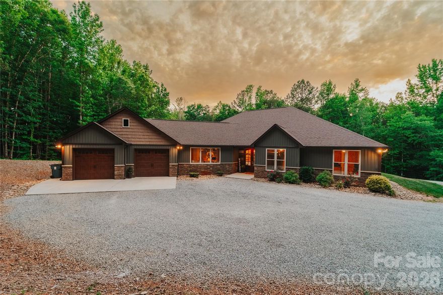 Imagine pulling up to your own private gated entrance and instantly feeling that deep sense of “I’m finally home.” This stunning property sits on over 19 acres of peaceful, tree lined privacy, and delivers everything you’ve been dreaming of and more!

The moment you step inside, you’re greeted by an impressive foyer that flows into a warm, open concept living space. Soaring vaulted ceilings and a cozy fireplace in the living room set the tone for relaxed evenings and unforgettable gatherings. 

The oversized gourmet kitchen is an absolute showstopper and is loaded with high-end KitchenAid appliances, a massive breakfast bar, incredible prep space, a huge walk-through pantry, and a dedicated coffee bar that’s perfect for lazy mornings or entertaining guests. 

Just off the kitchen, the sun drenched three season room with its own fireplace feels like your personal sanctuary. Picture yourself curled up with a book, watching the sunlight dance through the trees, or stepping out onto the expansive patio overlooking your private pond, fire pit, and garden. This is where memories will be made.

The thoughtfully designed split-bedroom layout gives everyone their own space. The primary suite is pure luxury vaulted ceilings, a spa-like ensuite with his-and-hers sinks and a beautifully tiled shower, plus a massive walk-in closet that leads into an exceptionally functional laundry room. Complete with storage galore, a laundry sink, and folding counter. 

On the other side of the home, you’ll find a large bedroom with its own full bathroom that is ideal for guests or as a second primary ensuite. Two additional bedrooms share another full bath, and one includes a charming loft that’s included in the sale. 

A spacious office with built-in desks and a half bath offers the perfect work-from-home setup, with convenient access to the two-car garage. The garage is complete with extra bump-out space perfect for a home gym or additional storage.

But the real wow factor? Your completely separate barn/venue. This is pure entertainment magic. Huge sliding barn doors open to a massive event space with its own full kitchen and bathroom that is perfect for weddings, parties, holiday gatherings, or whatever your heart desires. 

Upstairs you’ll find over 750 square feet of storage, a cupola that fills the space with natural light, and a fully finished one bedroom apartment with its own private back porch overlooking the pond. This is the ultimate bonus space most people only dream about this isn’t just a house, it’s a lifestyle. Privacy, luxury, and ready for you to move in and start living your best life immediately. Homes like this don’t come along often. Don’t wait, schedule your showing today and make this extraordinary property yours before someone else does.