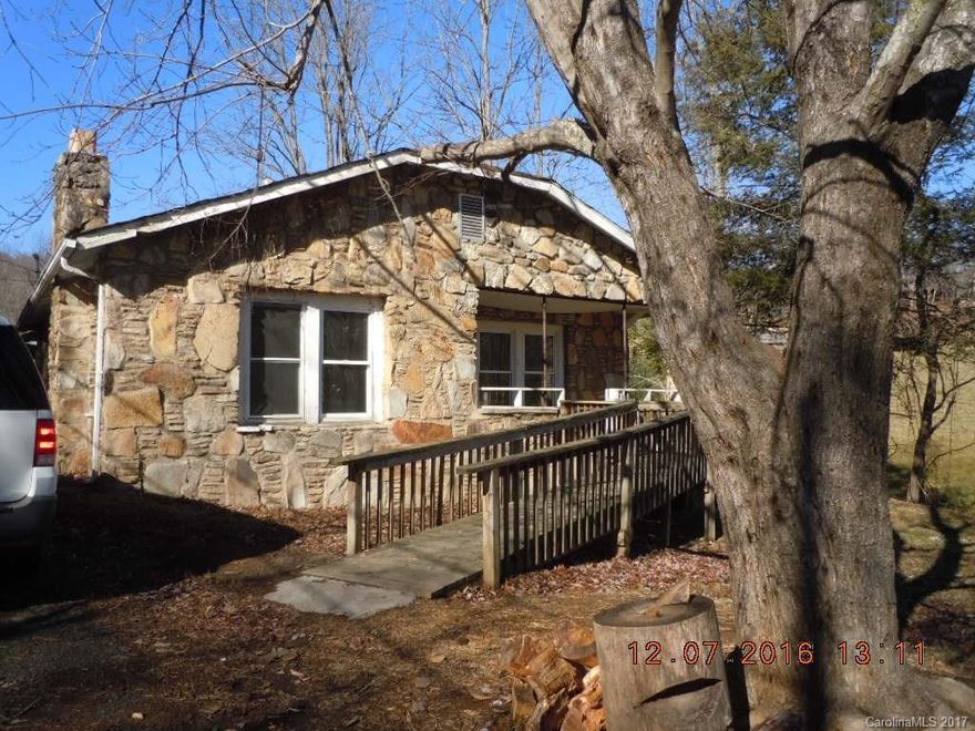 This home needs massive restoration including a new roof and full interior. The lot is easily accessible and there is a block 2 car garage. There is no well to the home, septic record not found.