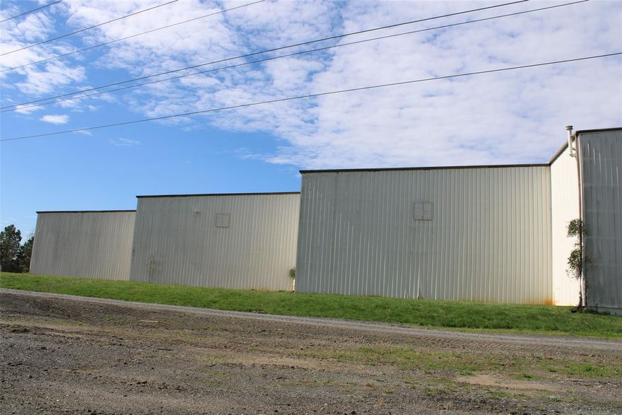2 Loading Docks 1 Ramp door, 60,000 sq ft warehouse. 24oo Sq Ft. Office has 2 Bathrooms. Approx. 15 acres to park! LED Lighting.
Office and Break room and 2 Bathrooms in Warehouse.  Almost New roof. Warehouse can be heated with natural gas.  No AC in Warehouse. Backside of Warehouse is approx. 30,000 sq ft with ceiling height of 50'. Front side of warehouse is approx. 30,000 sq ft with 25' ceiling height. Google address for driving directions. Landlord will discuss the terms of lease.
