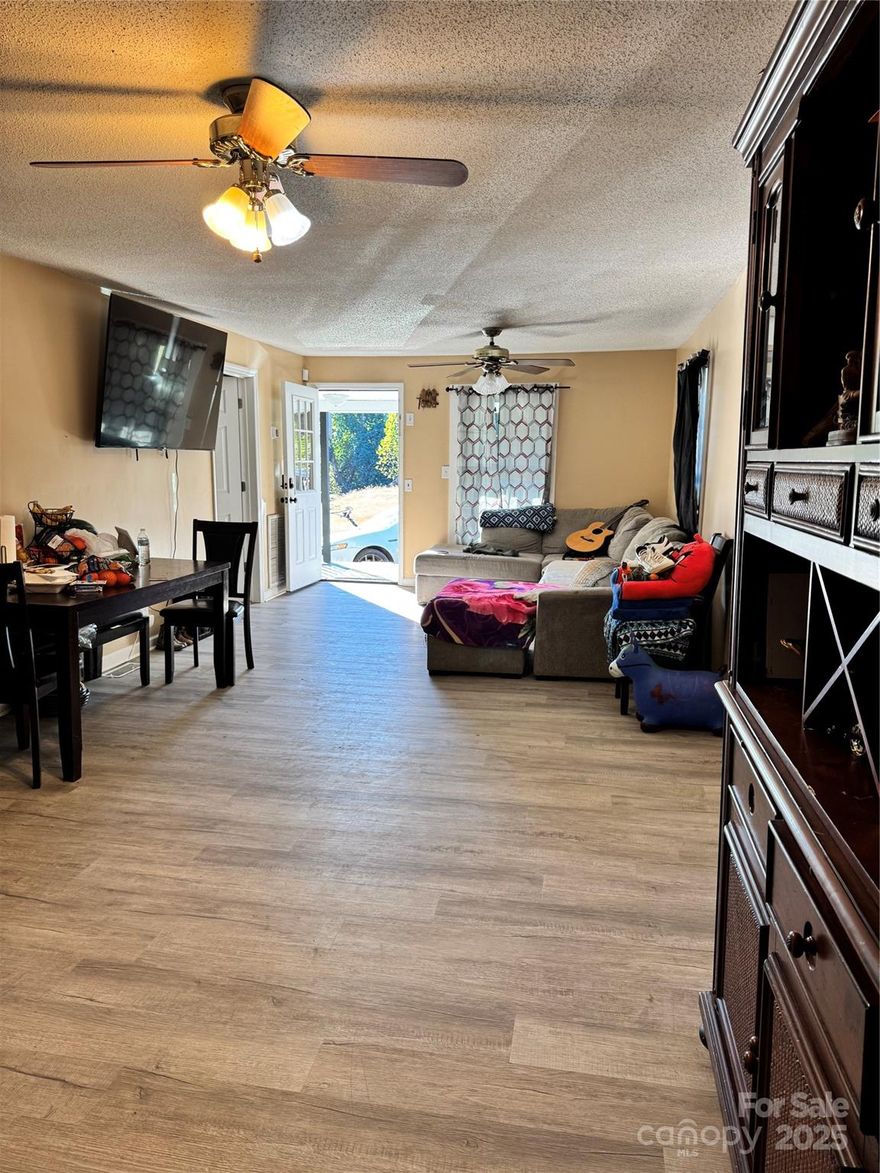 No HOA! Home completely redone in the last couple of years, including new floors, roof, siding, windows and HVAC. Property incudes new !0' x 20' shed and a 40' x 30' 3-bay wired garage/workshop all on approximately 0.25 acre. Must see to appreciate!