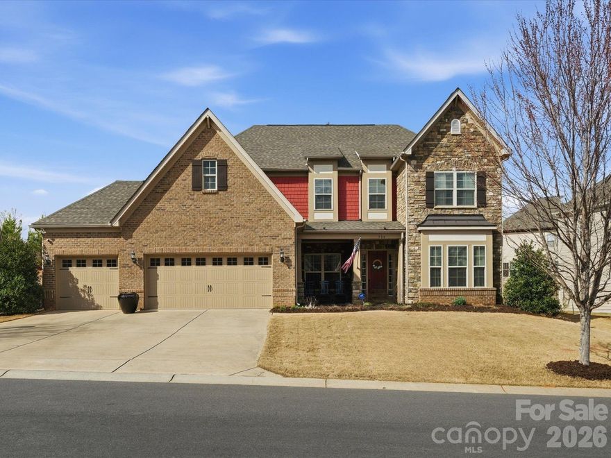 Welcome to this beautifully designed two-story home offering a spacious and functional layout with custom upgrades throughout.

The main level features a welcoming foyer, a formal dining room with a coffered ceiling, and a large great room with a coffered ceiling and stone fireplace with a wooden mantel. The kitchen is designed for both everyday living and entertaining, highlighted by a 13-foot island with outlets, crown molding, and a large walk-in pantry with custom shelving. The adjoining breakfast area features custom iron window accents and opens to a bright 3-season sunroom, creating a comfortable space to relax. A flex room with a shiplap accent wall provides the perfect office or additional living space, while a main-floor bedroom adds convenience for guests. The home also features a custom wine room and access to the outdoor patio, ideal for entertaining.

Upstairs, the spacious primary suite includes hardwood floors and custom closets. Two additional bedrooms and a large loft provide flexible living space, with the loft featuring custom cabinetry, a refrigerator, and surround sound—perfect for a media or recreation area.

The outdoor space is just as inviting, with in-ground sprinklers, outdoor lighting, a large patio with a wood-burning fire pit, and a fenced backyard. Additional storage is available with overhead garage shelving.

With thoughtful design, custom architectural details, and great indoor and outdoor living spaces, this home offers comfort, functionality, and style.