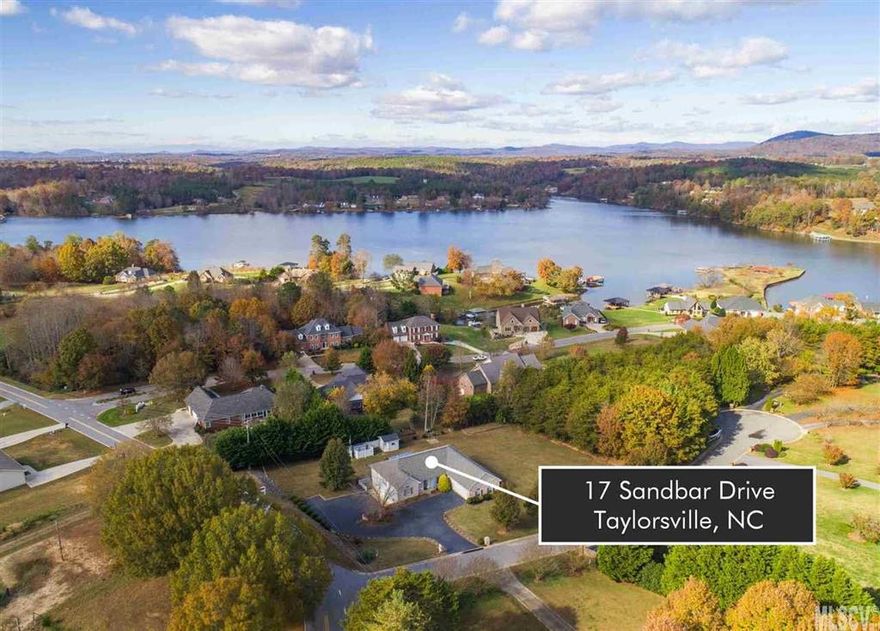 Lakefront community! This 3 bedroom home in Alexander Estates offers main-level living with full finished basement, over 3,300 heated square feet, and 4 garage bays! The main level features an inviting foyer opening onto a vaulted ceiling living room with stone fireplace, formal dining area, and arched entryways to a kitchen, featuring new granite countertops, gas range, pantry, & bayed breakfast area. A split floor plan offers a private master suite with huge walk-in closet and bath with jetted tub, separate shower, & double vanity. Two additional bedrooms share a hall bath at the opposite end of the house. The main level also offers a laundry room, sunroom, and a double garage. The full lower level has a spacious rec room, office, and bonus room with closet & window. You'll also find a huge double garage/workshop on the lower level. The 0.74 acre corner lot offers a storage shed, covered patio with swing, & plenty of room for a garden or outdoor activities.