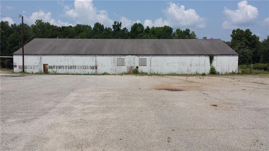 Approximate 13,000 plus square ft.  Industrial/Commercial. Manufacturing or Storage. Access to Loading Dock.
Property fenced in.  County.