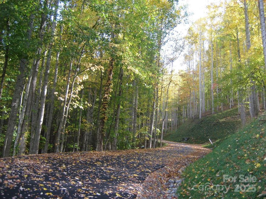 Two Very Buildable Lots with Mountain Views - End of the Road privacy - City Water - City Sewer - Paved roads - Spectrum Cable internet - Price includes two lots totalling 1.09 acres. A Flat driveway with room for a garage.. No minimum requirement to build but the neighborhood has an Architectural Review Committee. Even conventional looking modulars are allowed if approved.. Across the street is a Greenway area - so the view will have lots of trees in that direction.. Views will be to the West for Sunset and a Northern view.. But there will be good sunny southern exposure as well. House could have a daylight basement and garage on the main level - built on Lot 10
Beautiful quiet neighborhood.. 
Easy access location just off Soco Rd (Hwy 19) in Maggie Valley.. just a few minutes to historic downtown Waynesville, Ingles and Publix... Near the Cherokee casino.. Biltmore House in Asheville... and the Airport..