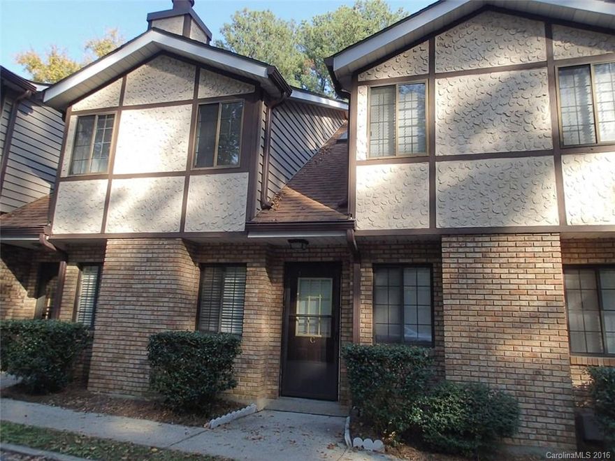 Secluded setting that's close to everything! Woods surround this excellent location just off South Blvd, half a mile to light rail and just minutes to Park Rd/Quail Hollow. Freshly painted and new carpet throughout. Large eat-in kitchen with spacious laundry room. Cozy, real wood burning fireplace in Living Rm. Refrigerator included. Water and sewer included in HOA fee.