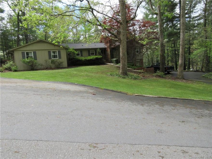 Desireable Kimberly Woods/Beaverdam nearCountryClub & N.Asheville hub. Character filled home,large wooded lot covered with rhodos & ivy.Exceptional outdoor space from huge wraparound deck.Open concept in living area, large MBR w/built-ins & lg. closet.Ample closets throughout.Great room w/full brick fireplace wall, indirect lighting and vaulted ceiling-not your typical ranch.Interior could use some updates.Home features natural gas generator and Rinnai water heater.Listing agent related to owner