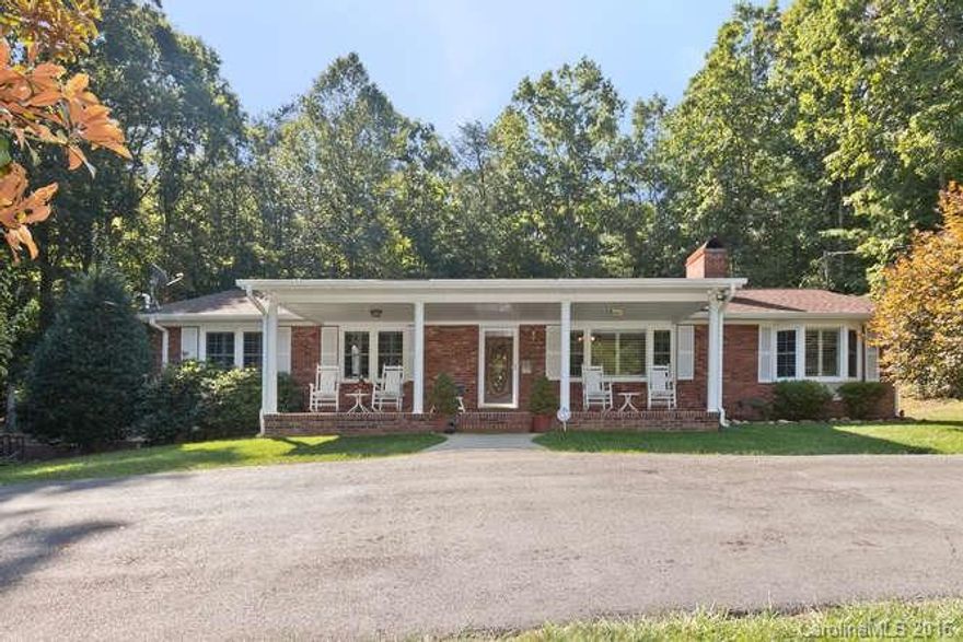 Beautiful brick rancher on basement in great South Asheville location on over a 1/2 acre. Relax and enjoy your coffee while sitting next to the waterfall feature. Renovated kitchen. Gas logs in main level living room fireplace and basement den. All bedrooms on main level with den and bonus rooms in basement. Pool table stays. glassed in sun room. Replacement windows throughout home. All appliances stay. Must see today!!!! Won't last long.Home Warranty