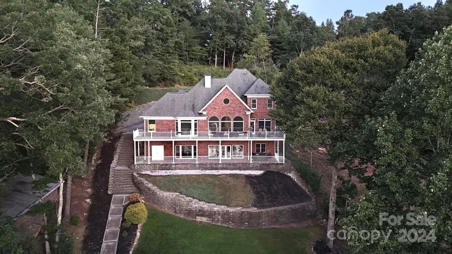 Experience the epitome of luxury waterfront mountain living at this remarkable retreat on Lake James. This inviting lakefront residence offers unparalleled serenity and sophistication. The open floorplan blends indoor elegance with the breath-taking scenery outside. Indulge in the comfort of the expansive master suite overlooking the tranquil lake. This home ensures endless opportunities for recreation and relaxation amidst the backdrop of the Lake James nature preserves. This lakefront masterpiece includes a premium boat dock, hot tub, home movie theater, home gym, and so much more. This home presents a rare opportunity to immerse yourself in the ultimate luxury of mountain lakefront living and adventure. 

Disclosure of Agent Relationship to Seller: Family Member