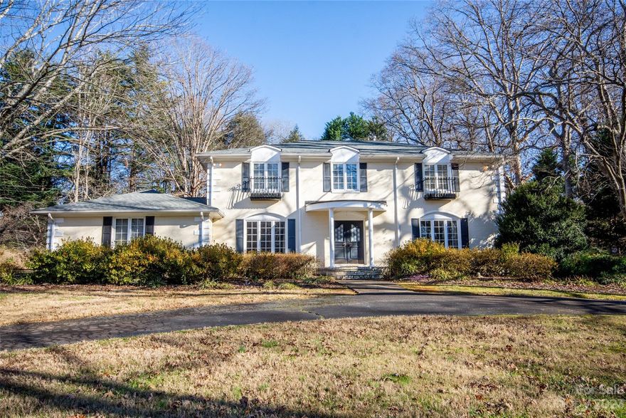 Discover timeless elegance in this French Provincial masterpiece in the desirable Shannon Acres community. Crafted from full brick, this residence is situated on a generous.77-acre lot.  The main level unfolds with a gracious living room with fireplace, offering a perfect space for relaxation. A coveted main level suite provides convenience and comfort, while upstairs, the primary suite awaits with a bathroom featuring dual vanities and granite countertops. Two additional bedrooms upstairs provide ample space for family or guests, accompanied by an additional bathroom boasting dual vanities, ensuring everyone's comfort. The sunroom on the main level invites natural light providing a picturesque view of the expansive backyard, perfect for enjoying the changing seasons. A well-appointed kitchen, equipped with two pantries and a gas stove.