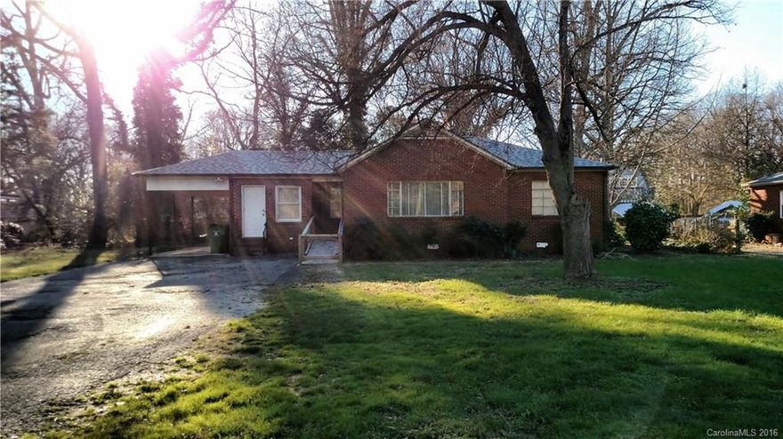Spacious brick one story on large lot with 2 brick fireplaces, recent roof, 2 full baths (2nd bath is handicap equipped w/ walk-in shower and jacuzzi tub). Note shared well (owned by this property) with house to right and septic tank. Electric Baseboard and Gas heat and Central A/C. Den could become large 3rd BR with fireplace if closet was added.Priced to sell "AS IS". Needs cosmetic upfits and some appliances may need repairs.