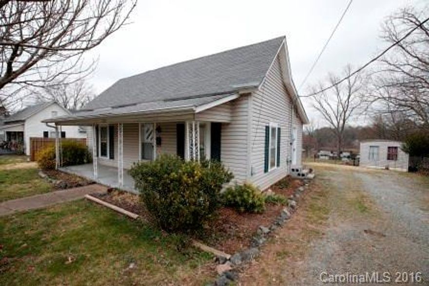 Charming 3BR/1.5BA bungalow located close to Hwy 321, I-40 and convenient to downtown Hickory. Over 1200 square feet, this house has a large living room and an extra space to be used as an office or den. Storage building in the backyard also remains. 205 sq ft does not meet state height requirements for heated square feet.