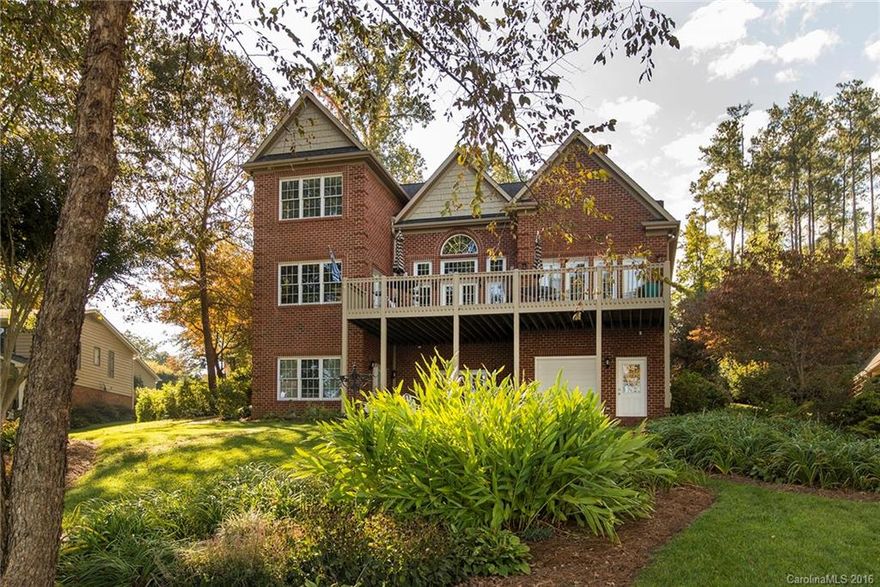 WATERFRONT home w/pier and meticulously landscaped grounds offers abundant privacy. Enjoy the expansive water view from your upper balcony porch & patio. Gourmet kitchen w/water view breakfast plus formal dining. Master on Main. This home is loaded w/storage; huge walkout attic, extra large closets, & lower level garage/workshop with bath. 2nd living quarters with separate kitchen and laundry in lower level features a family room, bedroom, sunroom, & flex space. Whole house water filtration.