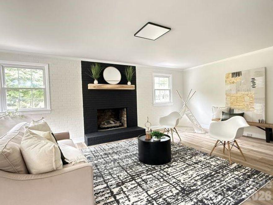 Priced well below appraised value for a quick sale. Tucked into a quiet, established Mint Hill neighborhood, this beautifully renovated home offers comfort, style, and space for everyday living. The flexible layout includes a second living area with a cozy fireplace and built-in wet bar, perfect for family movie nights, a playroom, or hosting guests. Inside, enjoy abundant natural light, LED lighting, durable LVP flooring, a custom accent wall, and a stunning kitchen with quartz countertops, tile backsplash, shaker cabinets, and stainless steel appliances. Updated bathrooms feature modern tile and fixtures, while the primary suite includes a walk-in closet and a beautifully finished shower with a frameless glass door. Outside, relax in the spacious backyard or unwind on the large deck with an electric awning, ideal for gatherings, grilling, or quiet evenings. This is a wonderful place to call home in one of Mint Hill’s most desirable areas.