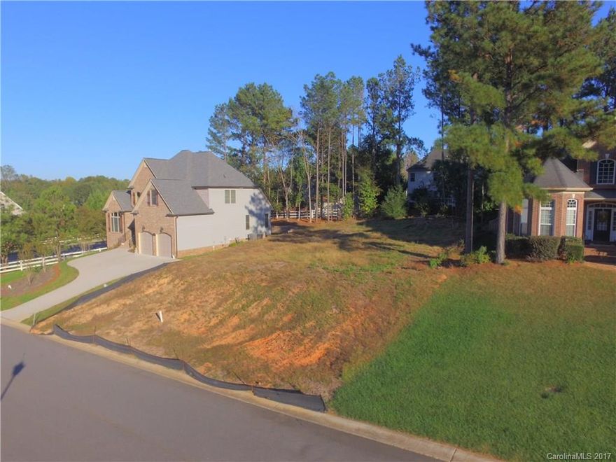 Cleared lot ready for your dream home! Beautiful neighborhood offering a pool and clubhouse. Enjoy a stroll with the family without having to walk in the street, this neighborhood has sidewalks! Are you an investor? The average home in this neighborhood has sold for $320k(up to $385k), in the last 6 months. 6 of the last 8 homes sold here averaged 9 days on market and sold for 98.5% list price. Great potential!! Very convenient access to I77. No matter your situation, this is the lot for you.