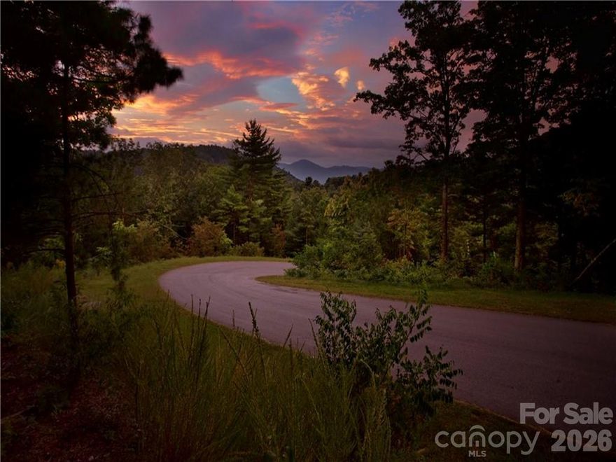 Huge price reduction. Motivated seller. Large 1.39 acre homesite  in Versant, Asheville's premier gated community! Versant offers the best location, and best new construction value in Asheville! This large 1.39 acre lot in Versant offers the perfect place to build your new mountain home! Versant includes public underground utilities (city water, electric, natural gas, public sewer and recently-added high-speed internet), privately maintained roads and community trail system, gated entry, all just 3 minutes to Merrimon Ave. and 8 minutes to downtown Asheville! The new owner will enjoy the privacy and convenience to town that only this property can offer!