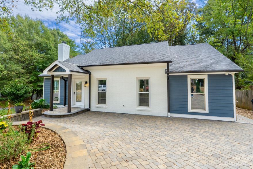 Welcome Home to this GEM! Be prepared to be impressed! From the beautiful cobblestone driveway that welcomes you to this totally renovated 4 bedroom / 2 bath ranch! NEW roof, NEW siding, NEW windows, NEW paved driveway, NEW deck, NEW covered back porch and retaining wall. As you enter the open floor plan, you will see beautiful LVP flooring throughout! The wood burning fireplace has a gas option and can be converted. The completely renovated kitchen boasts custom open shelving along with quartz counters. Both full bathrooms are completely updated with modern black and white colors. Fresh neutral paint throughout the house! The back yard is everything in this home! The covered porch is simply breathtaking! You will fall in love with the outdoor space enclosed by your privacy fence! Enjoy a 200 sq ft storage shed that could be whatever you need it to be! Schedule your private showing today!