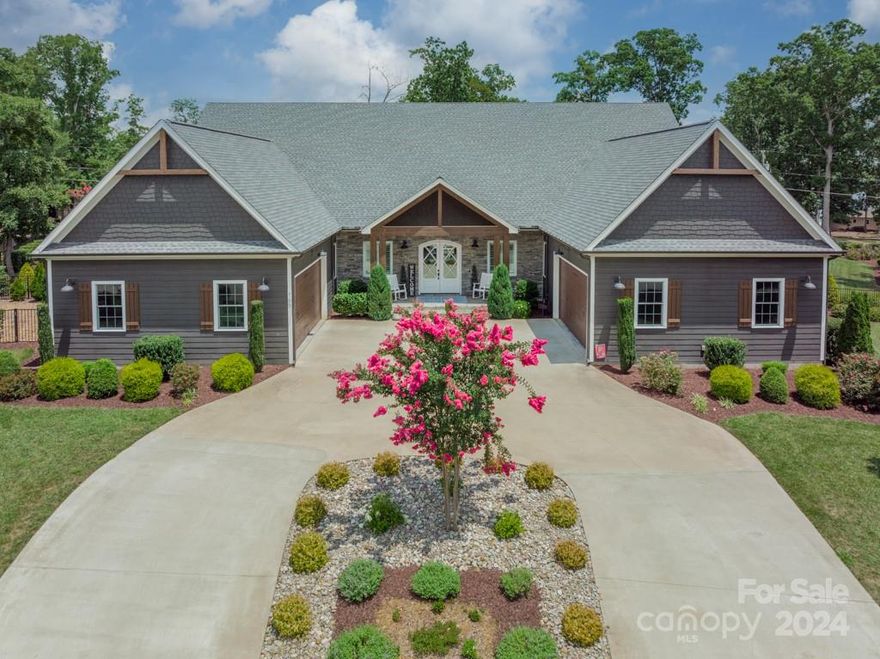 Pack your suitcases, because you'll NEVER want to leave home again! A RARE find in the Exclusive gated section of TNC. 2017 build with beautiful designer features throughout and spacious open floor plan that conveniently opens to your gorgeous chef’s kitchen, dining areas and rear patios for a perfect entertaining flow. Enjoy a massive island with granite countertops, surrounded by custom white kitchen cabinets and oversized farm sink! An oversized primary bedroom and ensuite, sun filled multi purpose space & 2 additional oversized BR’s ensure single level living if you desire. Once upstairs, media room, game room & upstairs balcony with stunning Lake Norman views and 2 additional BRs.Walk-in storage will be a welcome addition for seasonal items.Not only is this property located on a cul-de-sac lot with rare 4-car garage, but your new heated saltwater pool and grilling station will give you resort vibes throughout. A DEEDED BS at desirable Pier Z is an added bonus to enjoy LKN