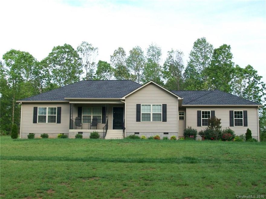 Wonderful Custom Home with all the upgrades.  All hardwoods with ceramic tiles in baths and utility room.  Granite countertops.  Walkout door on garage, extra concrete parking.  Large covered rear porch.  Super nice.  Almost new  live in 1 year!