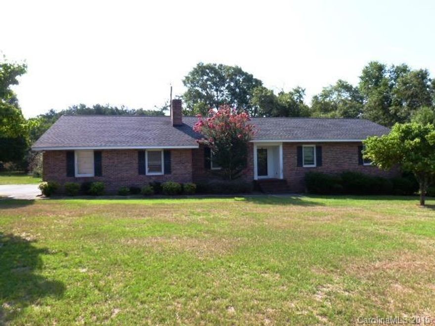 Country living at its best. Come take a look at this totally updated home features new flring, updated kitchen with new appliances, fresh paint throughout, new shutters. Other rooms include the DR, LR, den, two fireplaces, dbl garage & large laundry room. Lots of storage. Home sits on two beautiful acres with old barn. SOLD AS IS!